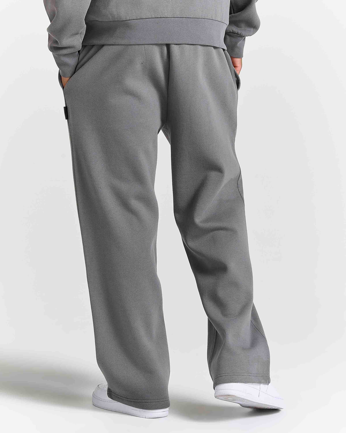 Displays a model wearing the grey lava smoke 'Hoodrich' branded Forza Oversized Wide Leg Jogger