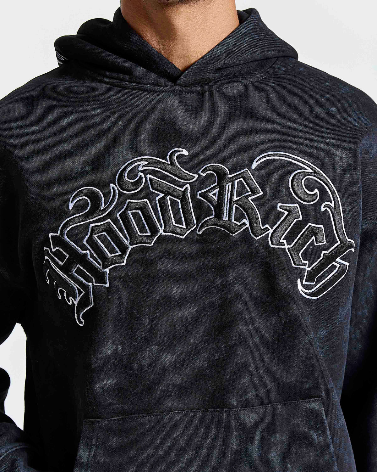 Displays a model wearing the Black 'Hoodrich' branded men's Nocturn Full Tracksuit featuring the hoodrich logo branding