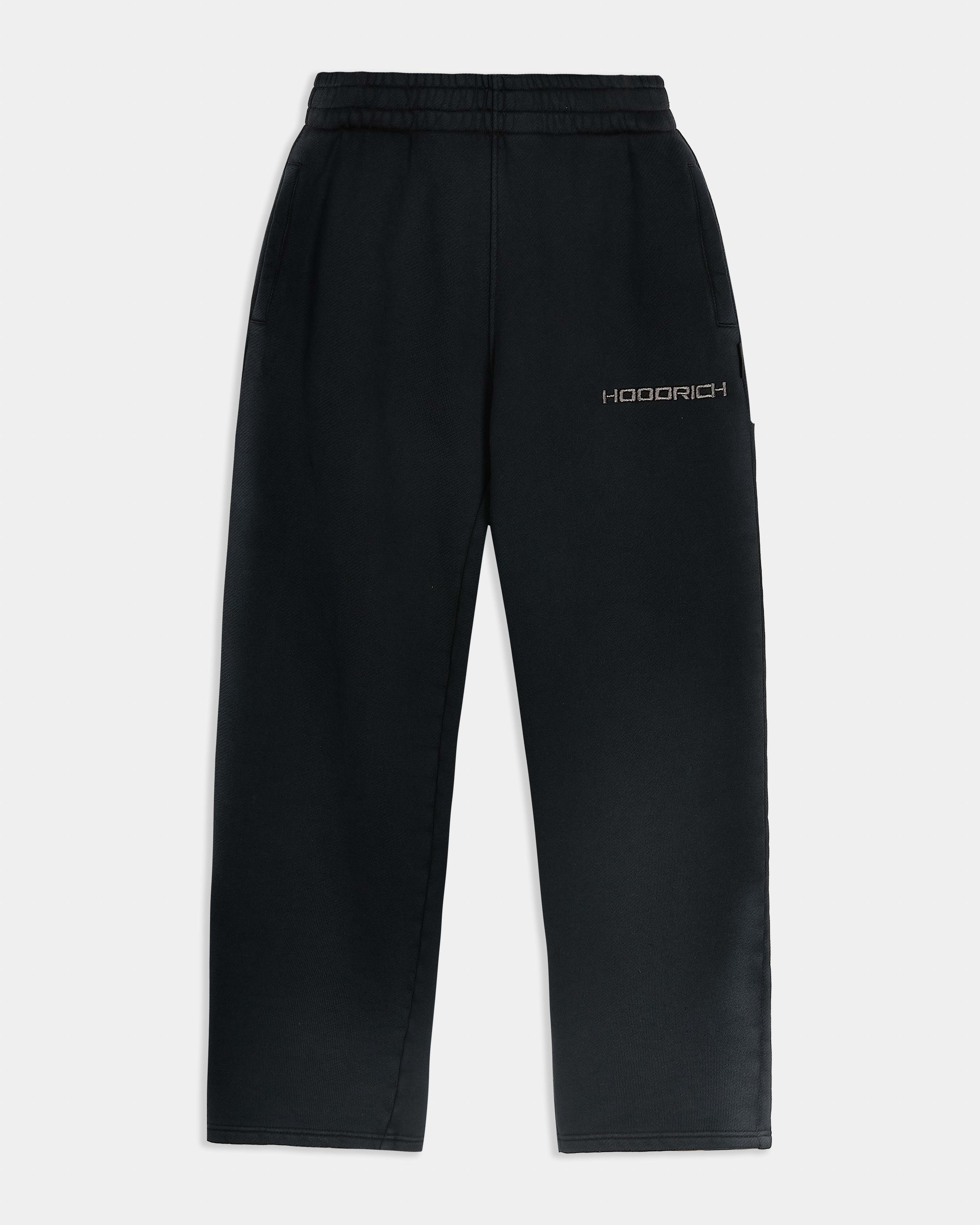 Black wide-leg joggers featuring a high-waisted elasticated waistband, side pockets, and an embroidered Hoodrich logo on the leg.
