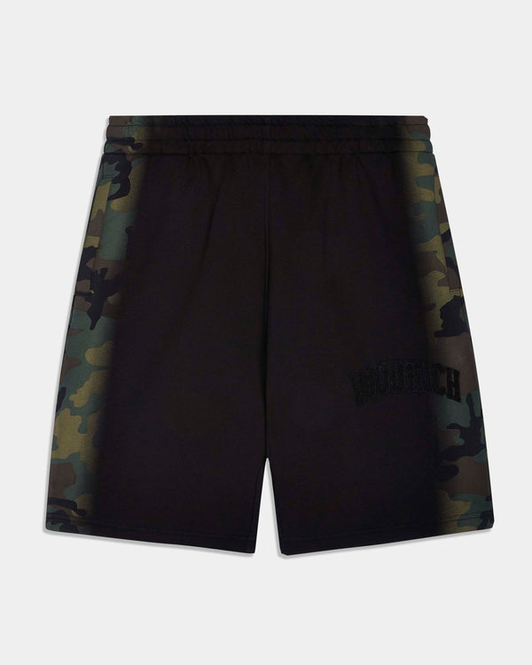 Black camouflage athletic shorts with a subtle tonal logo on the lower right leg, displayed against a light gray background.