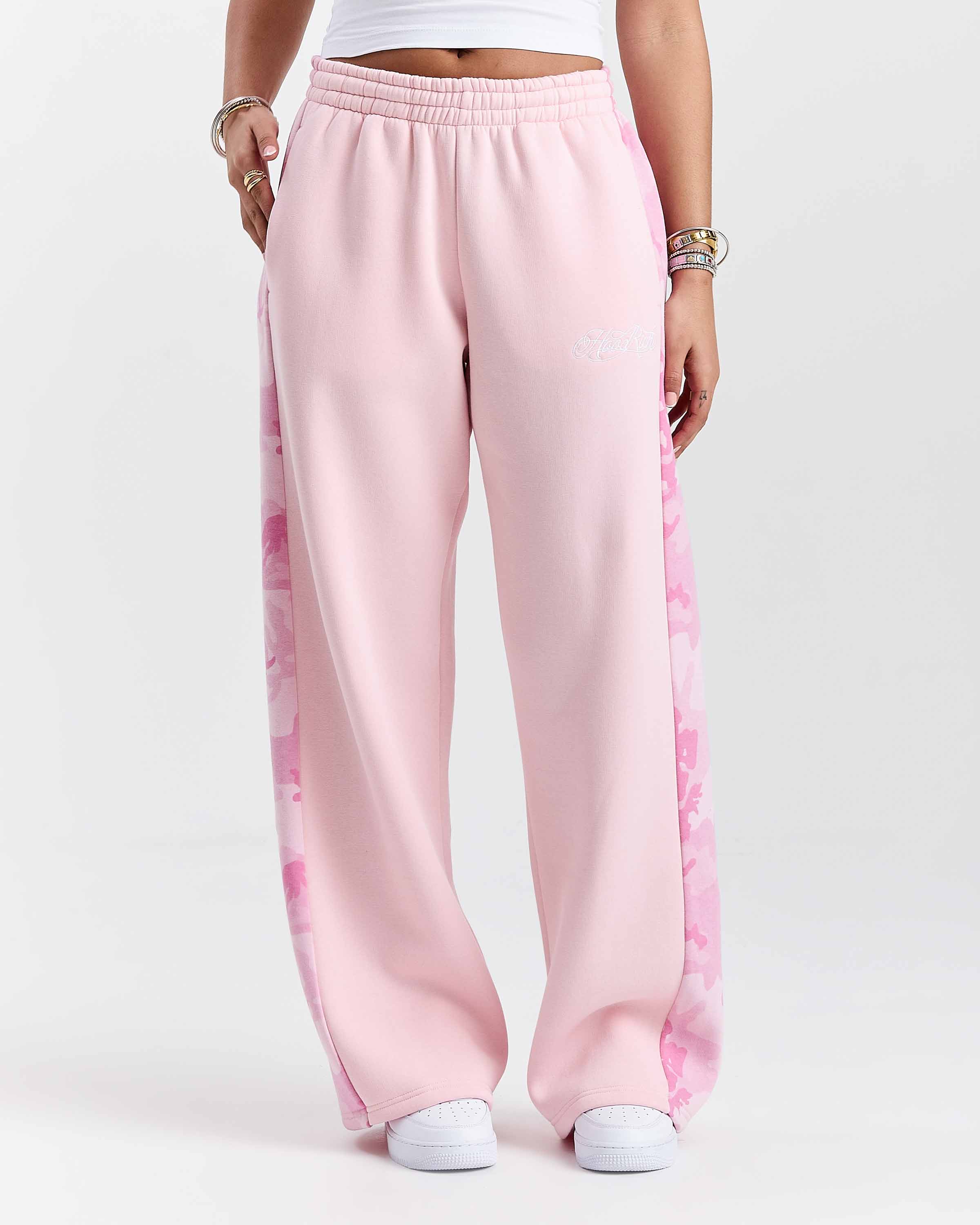 Displays a model wearing the Pink "Hoodrich' branded women's Field Full Tracksuit