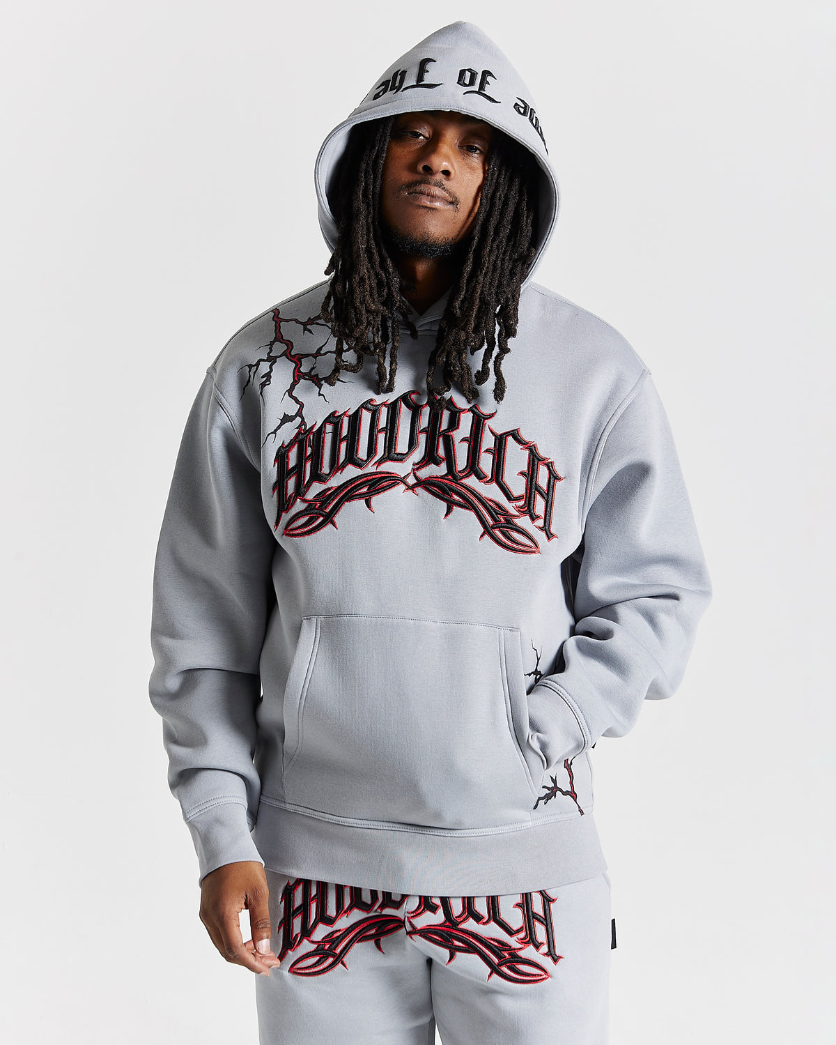 Displays a model wearing the Grey 'Hoodrich' branded men's Dark Full Tracksuit 