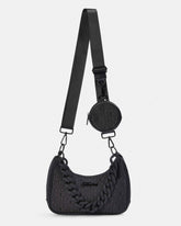 Black textured handbag with a matching round pouch on a light gray background