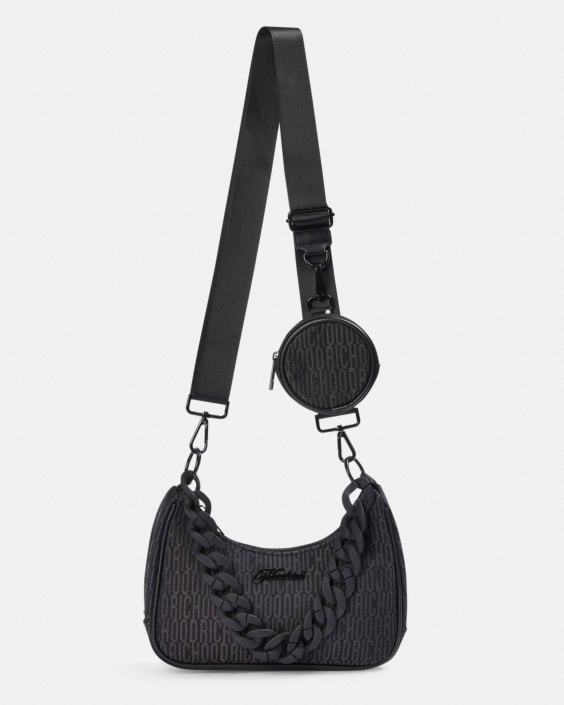 Black textured handbag with a matching round pouch on a light gray background